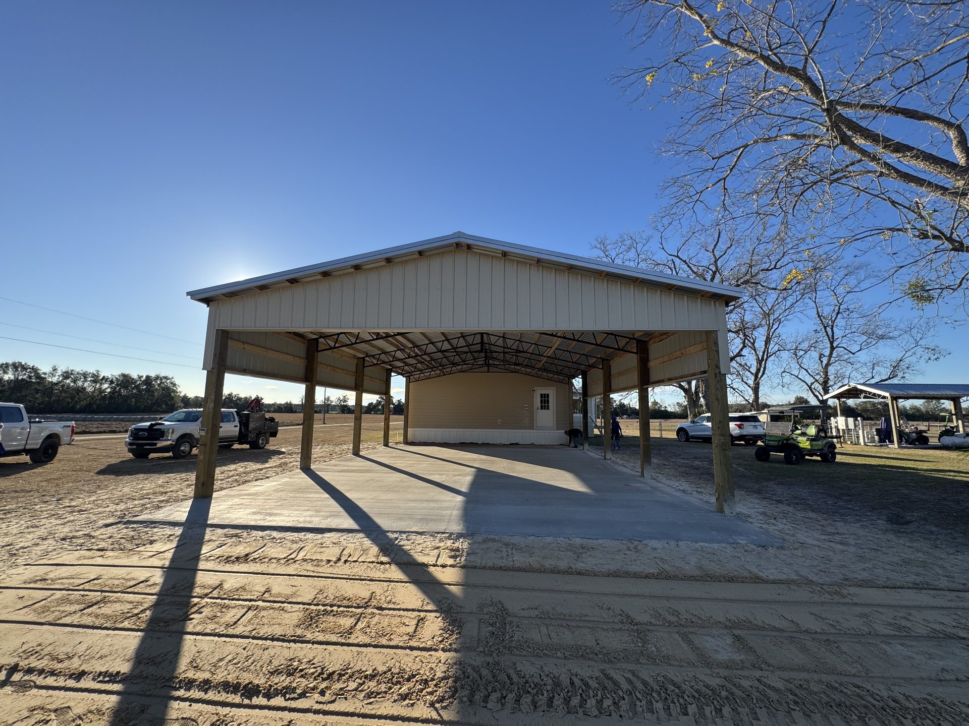Pole barn exterior with treated posts and standing seam metal roof