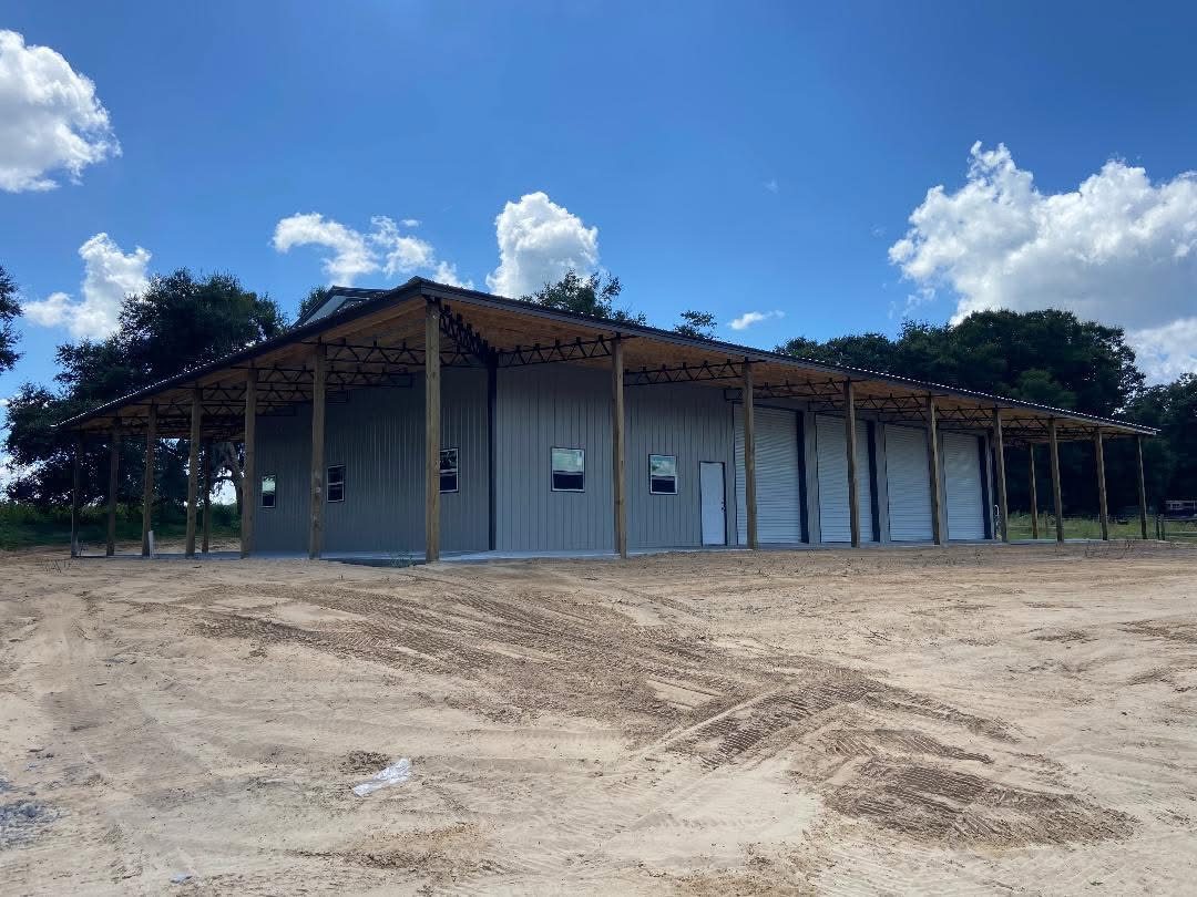 Custom pole barn with roll-up doors and metal siding