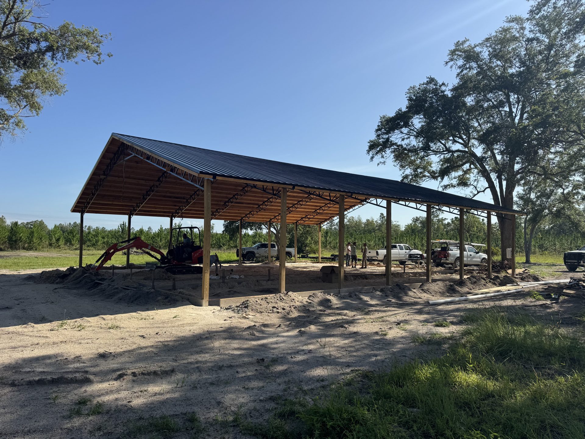 Pole barn exterior detail showing metal siding and roof trim