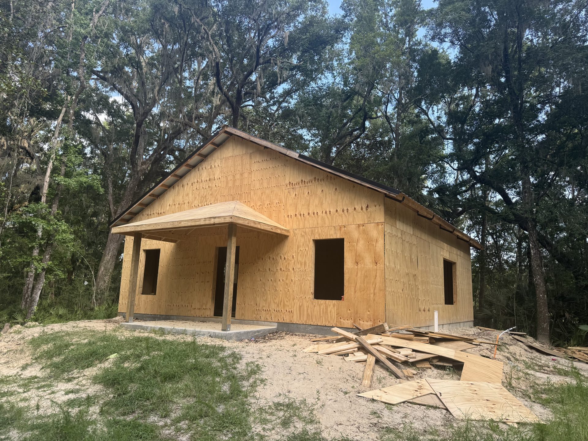 Completed pole barn on rural acreage with blue sky