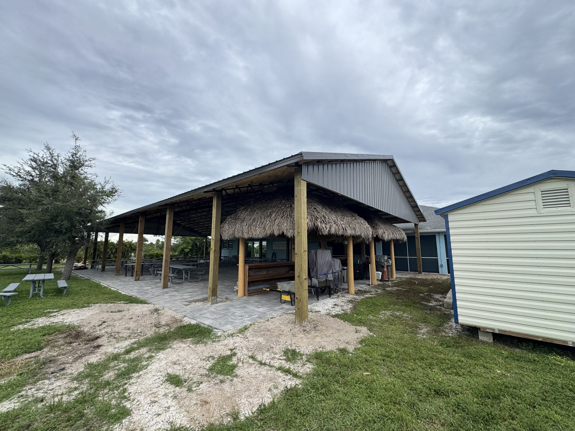 Custom barn build on Florida property — metal roof and treated posts