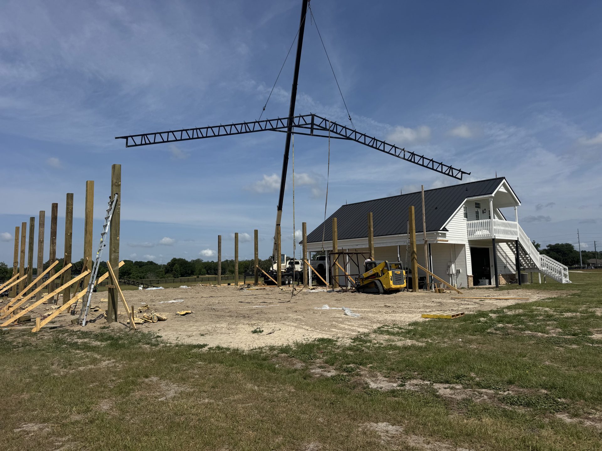 Custom enclosed barn with overhead door on Florida acreage