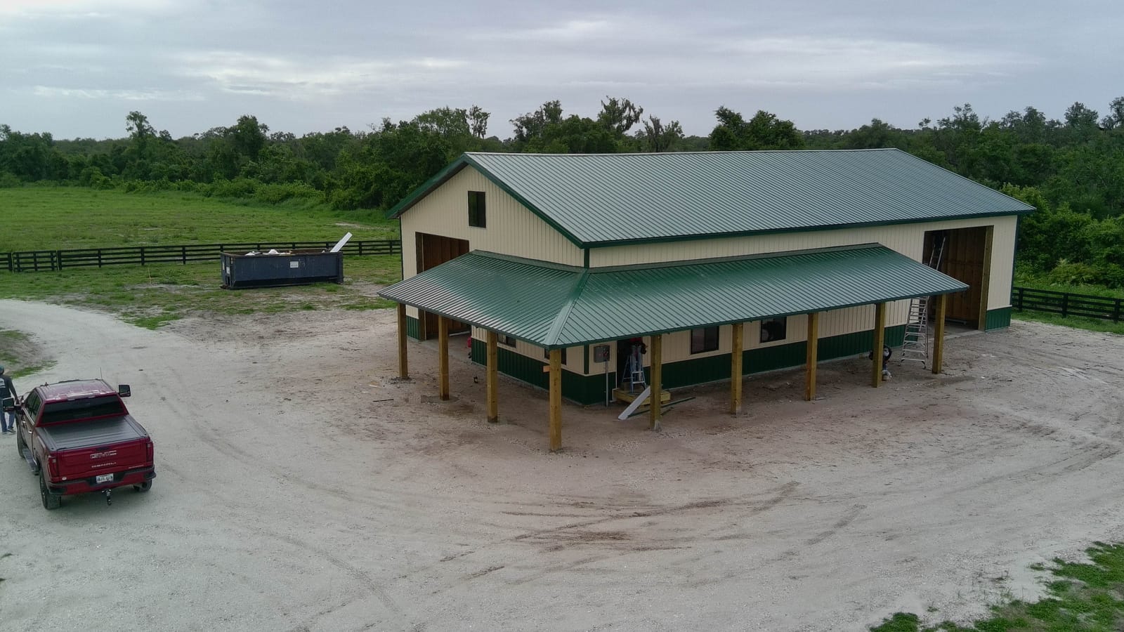 Barndominiums — Aerial green-roof barndominium porch
