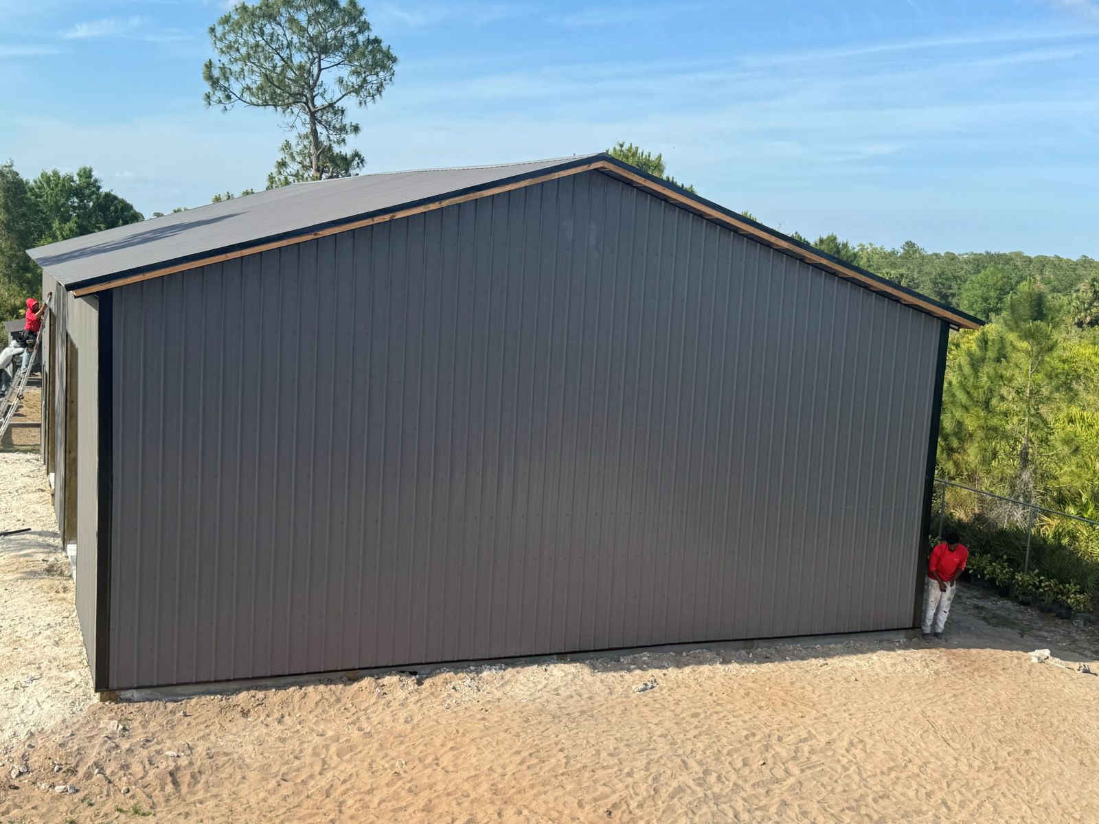 Enclosed Pole Barns — Charcoal gabled metal barn