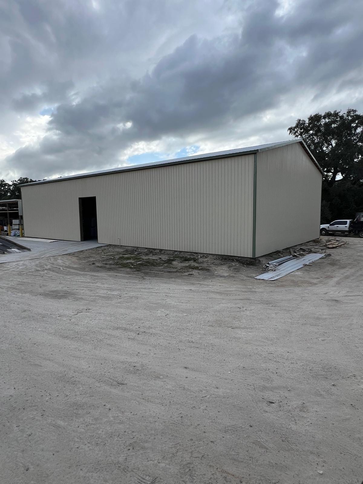 Enclosed Pole Barns — Large tan enclosed workshop
