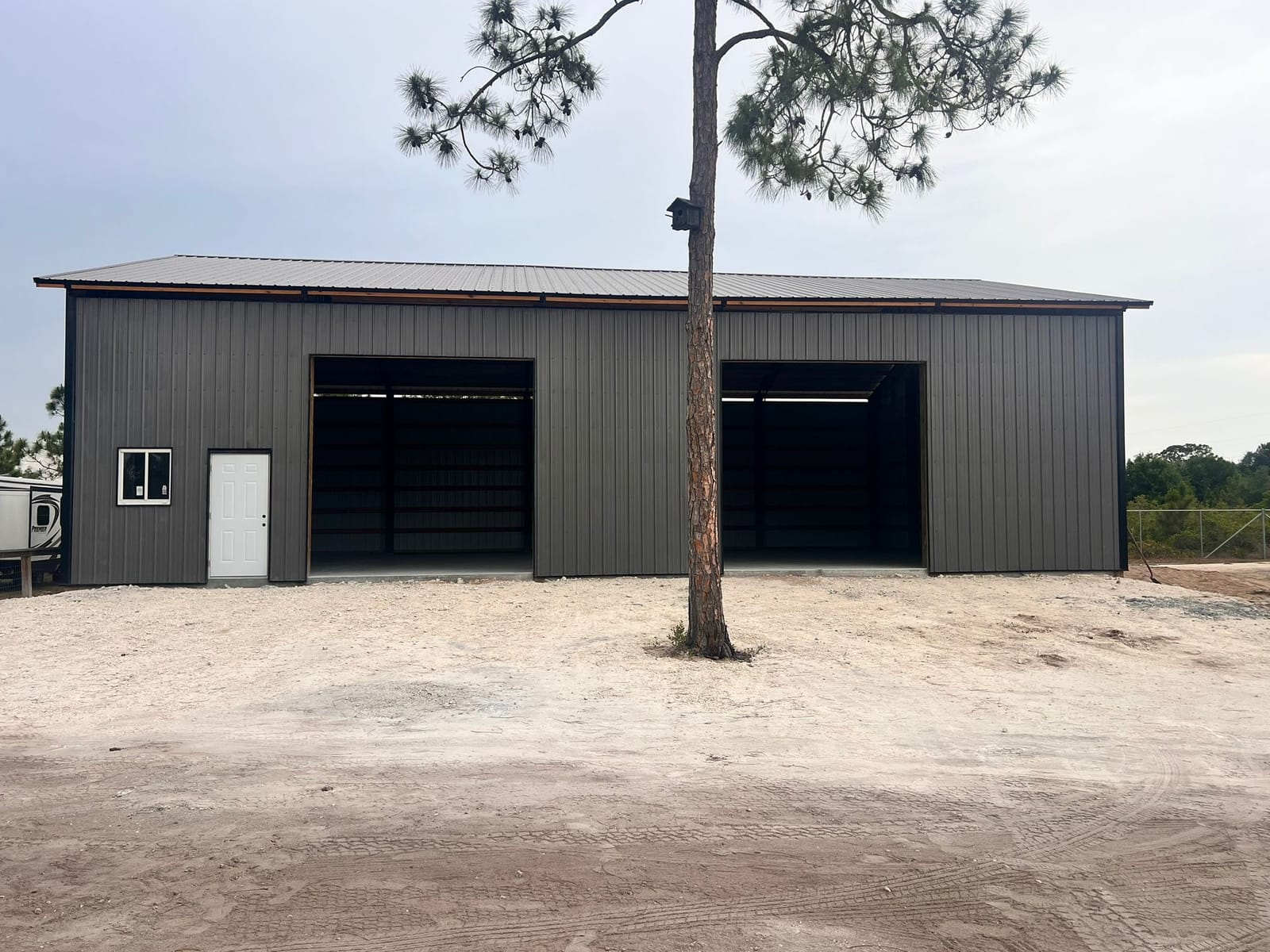 Garages — Charcoal two-bay garage with pine