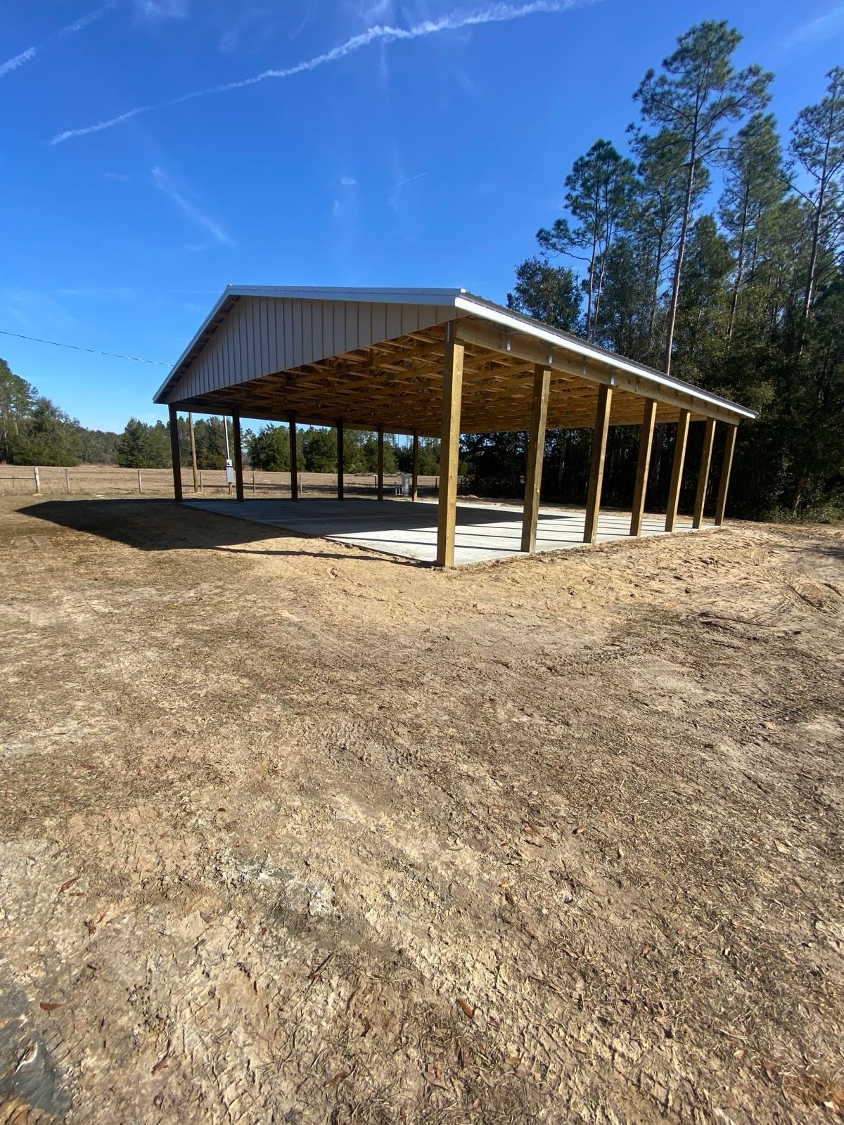 Open Pole Barns — Open pole barn with white roof